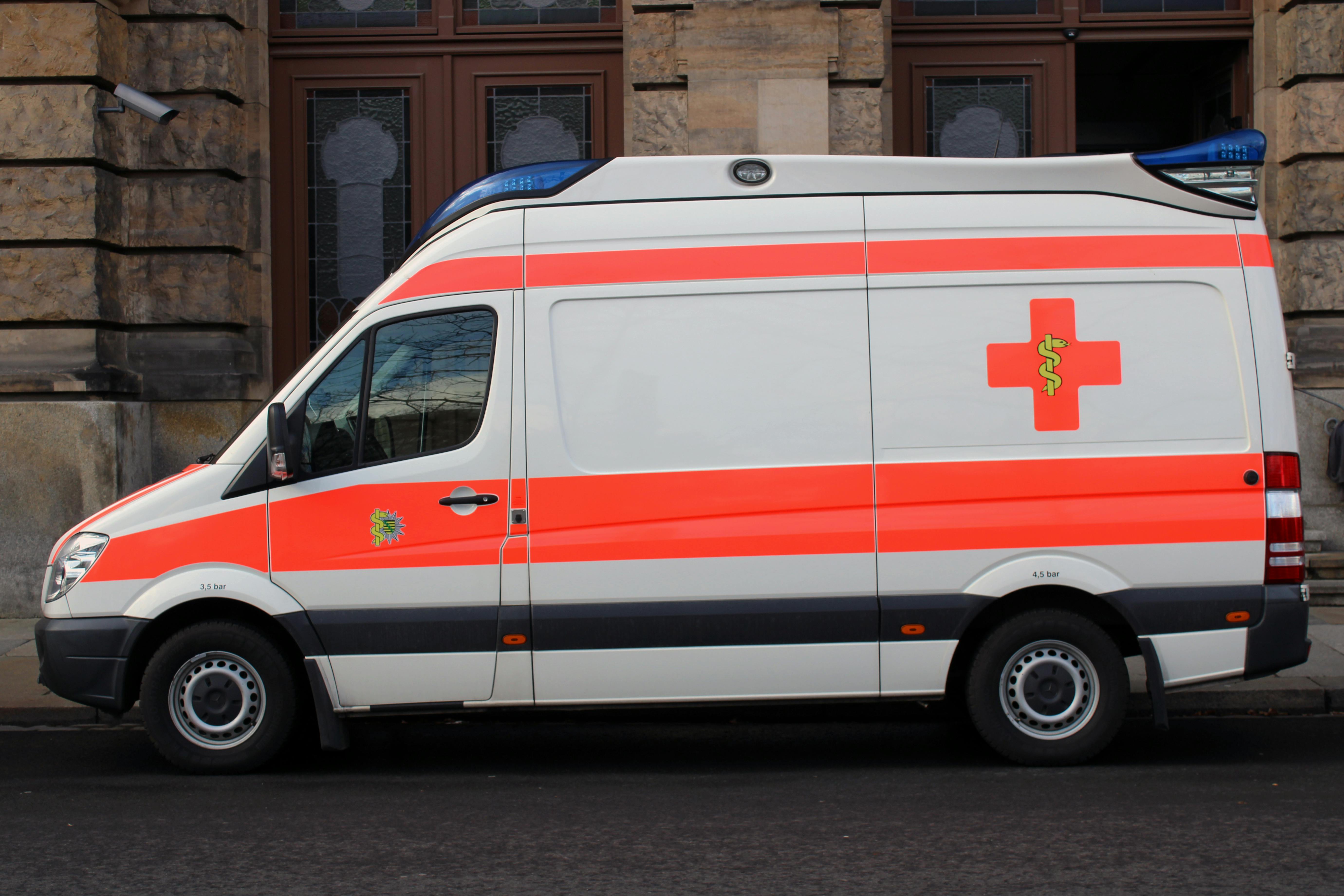 White ambulance with red cross